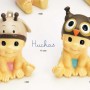 Figura huchas bebé gorrito como regalo de nacimiento