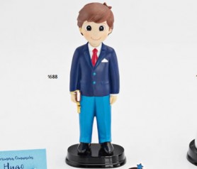 Figura de comunión niño con traje azul y libro en la mano